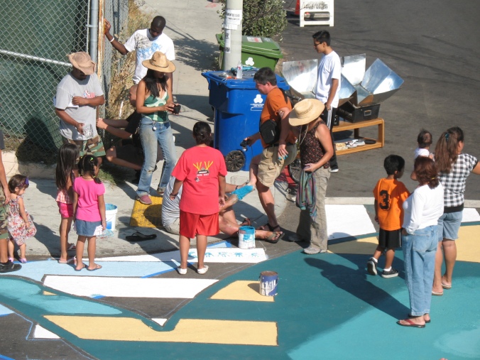 At the end of the day we painted handprints and footprints of all the folks who worked on the mural. Here's Mark Lakeman getting his foot painted blue, so he can print it on our new crosswalk. Photo by Yuki