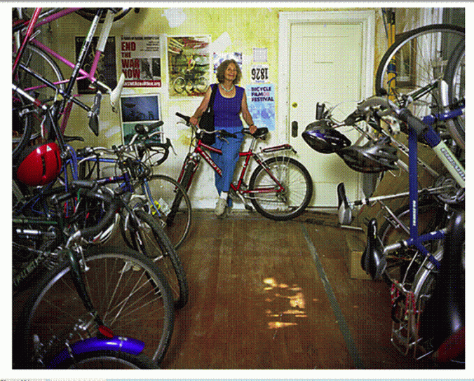 Lois Arkin in the LAEV bike room. The door to the right of her is the kitchen where the Bicycle Kitchen got its start.