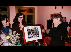 Yuki Kidokoro and Becca L present congratulatory photo collage to a speechless Lois Arkin 